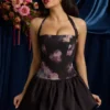Nanala Halterneck Lace-Up Bubble Hem Mini Dress in Black Floral Print Nanala Halterneck Lace-Up Bubble Hem Mini Dress in Black Floral Print