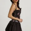 Nanala Halterneck Lace-Up Bubble Hem Mini Dress in Black Floral Print Nanala Halterneck Lace-Up Bubble Hem Mini Dress in Black Floral Print